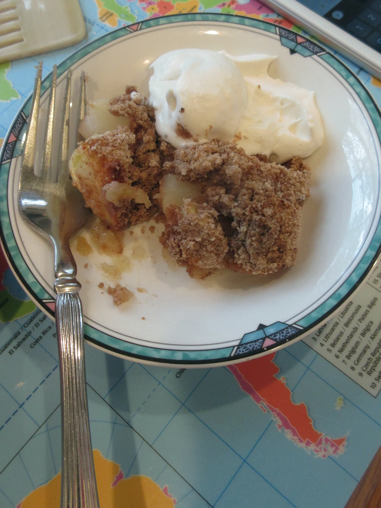apple crumble: Fresh baked apple crisp, in bowl with whipped cream