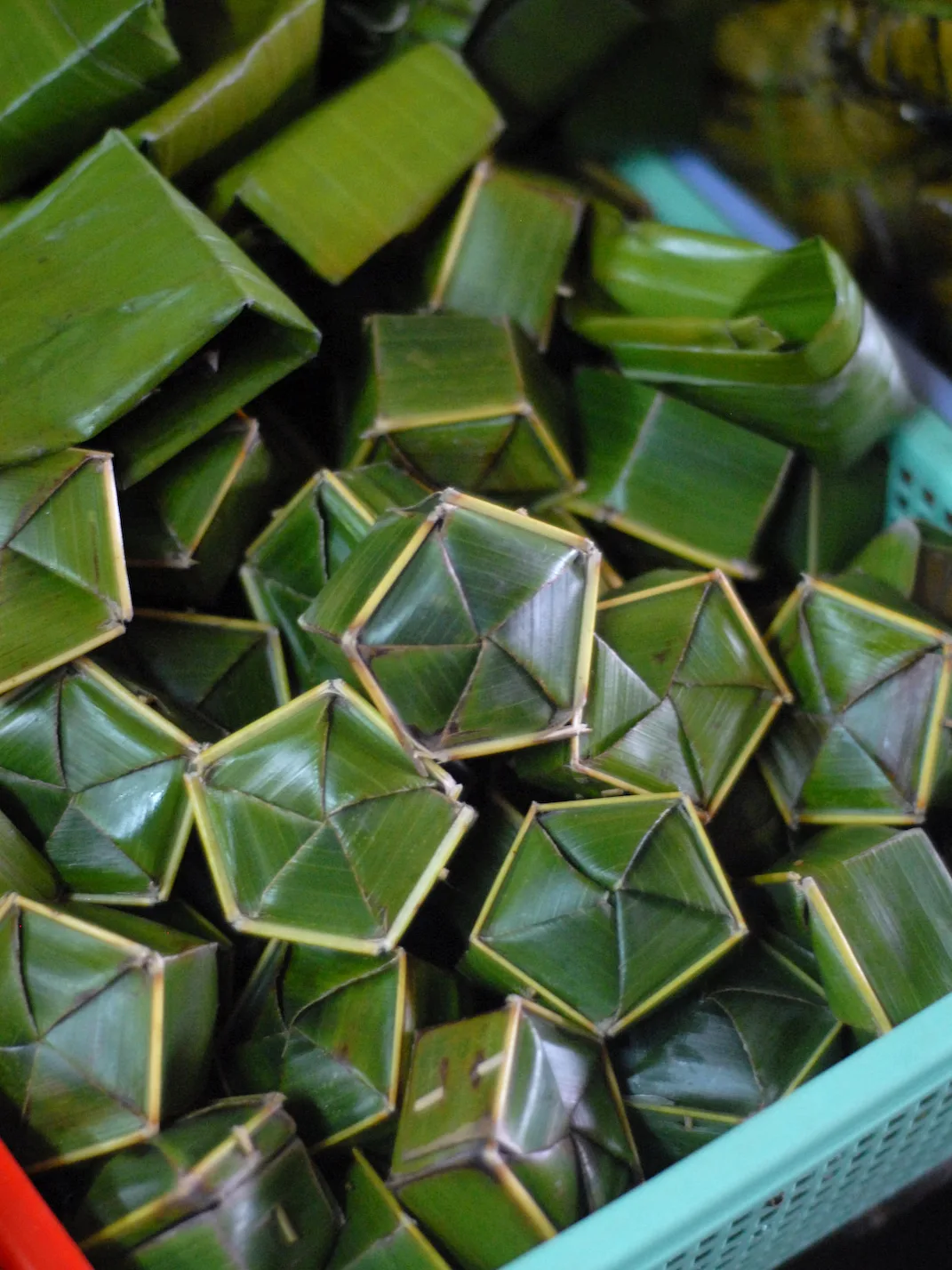 Phu Thê Cake: The traditional Vietnamese wedding cake, Phu The. Phu means man and The means woman. The cake is wrapped in palm leaves in a Hue market