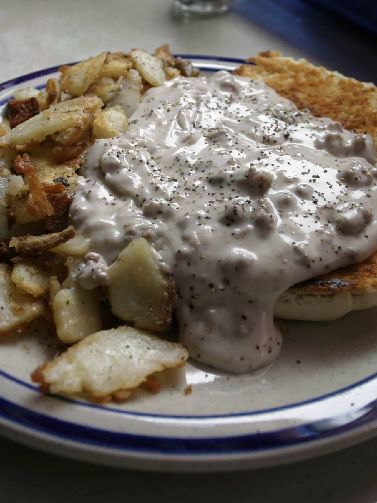 biscuits and gravy, a photograph of the dish
