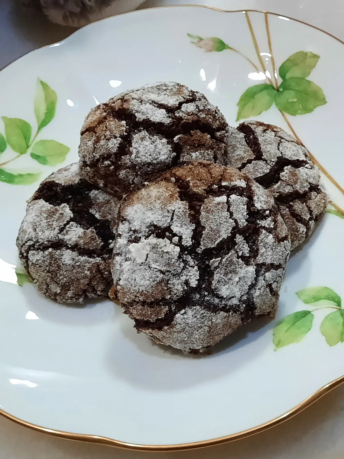 chocolate crinkle: Pictured above is a plate of chocolate cookies with powdered sugar on top