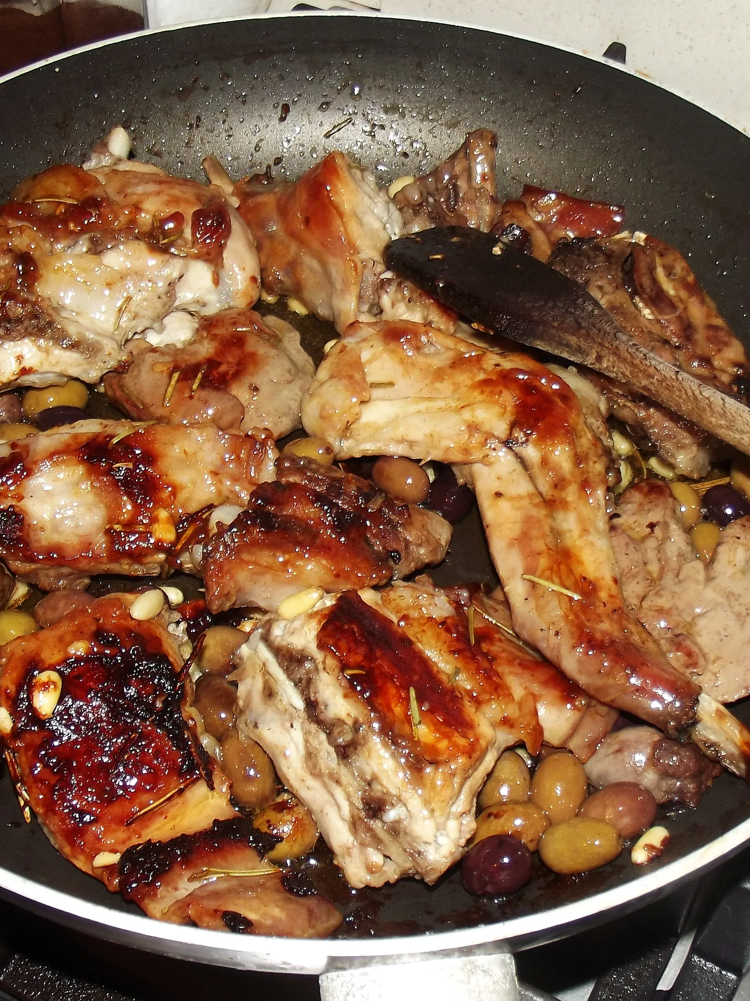 coniglio alla sanremese: Ligurian style rabbit with olives and pine nuts