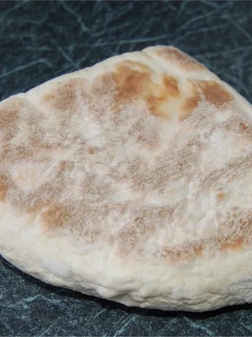 Farl: A Soda bread farl. This farl would have been connected to the others along the top and right hand straight edges
