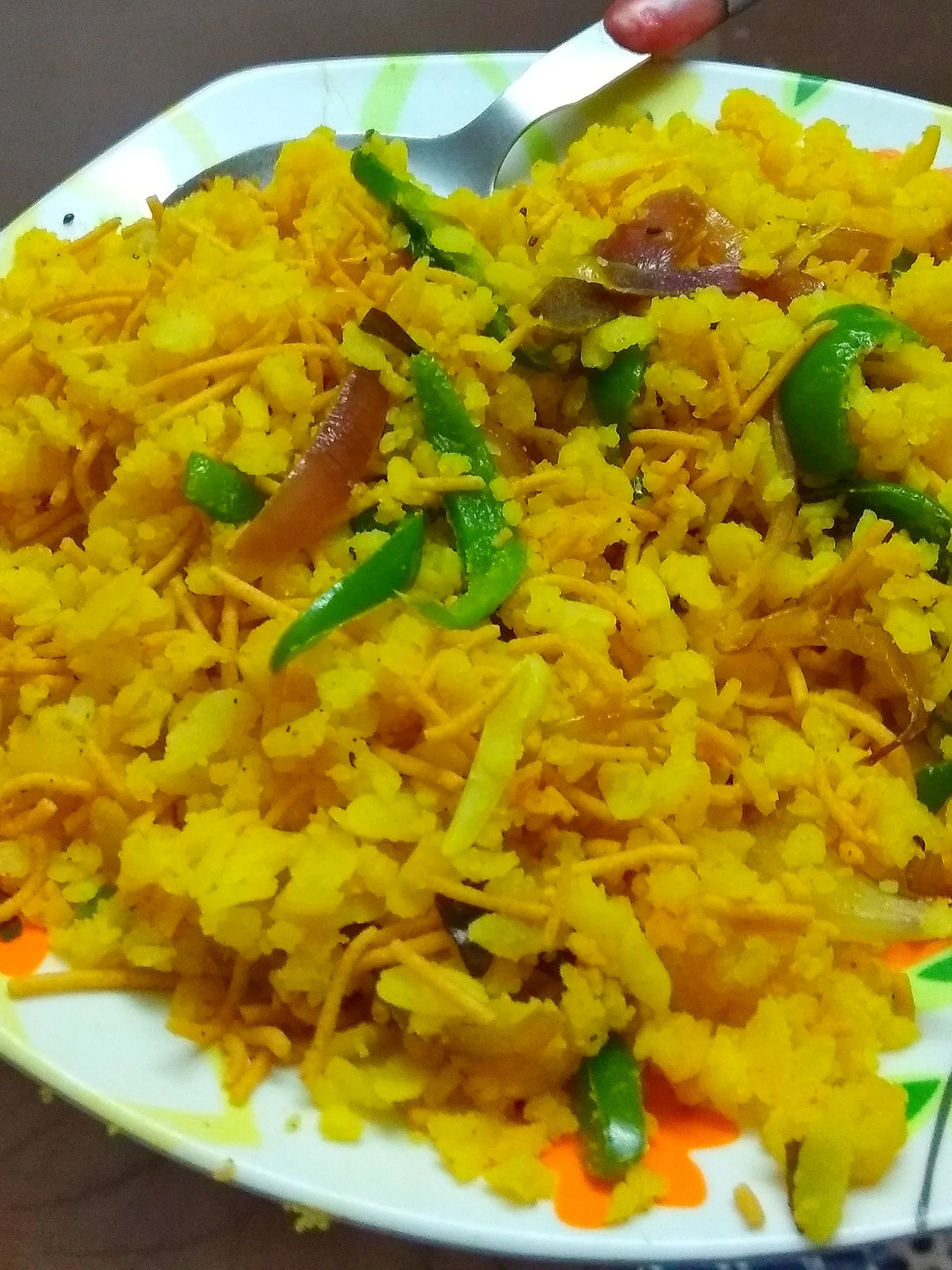 Indori Poha: Poha is a flaked rice Indian Dish from Indore