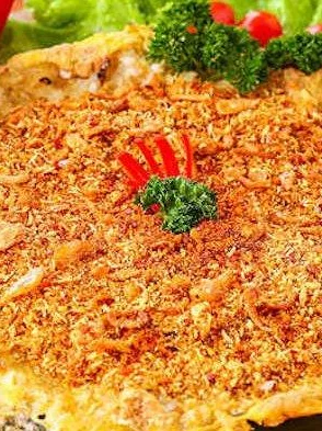 kerak telor: kerak telor very unique, because it is made of rice and chicken or duck eggs, which are put together and cooked on a small cauldron and firewood