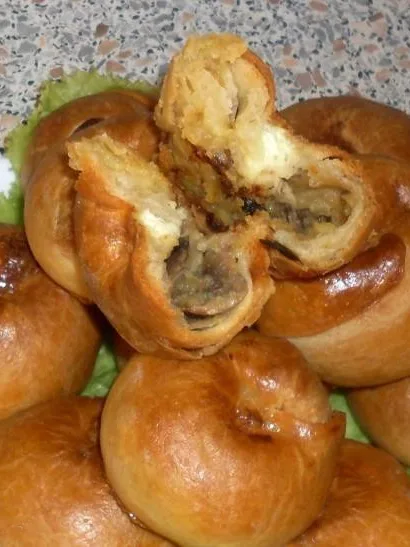 knish: Knishes (knyshes) stuffed with mashed potatoes and fried onions