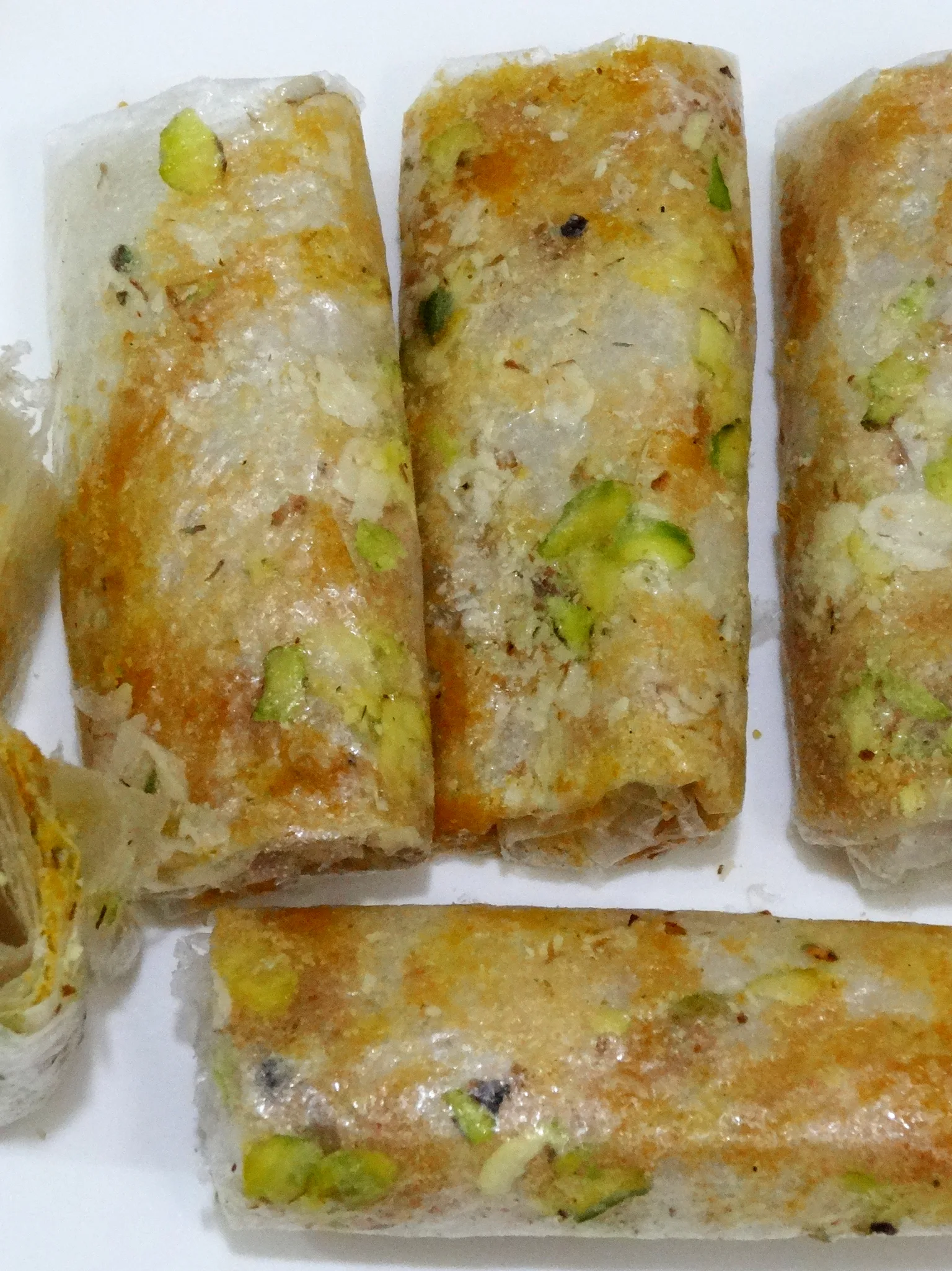 Pootharekulu: Pootharekulu or Poothareku (singular) is a popular sweet from Atreyapuram, East Godavari, India. The Pootharekulu in the picture is filled with jaggery, badam & pista