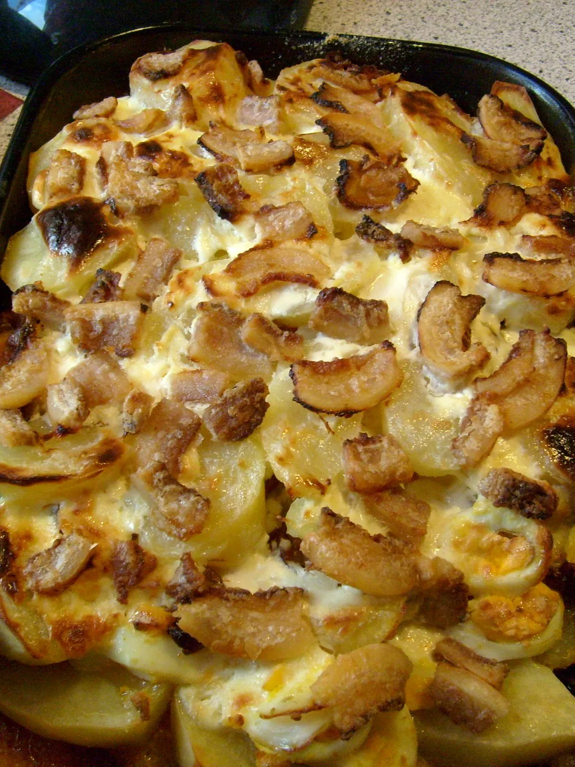 Rakott krumpli: Rakott krumpli - a Hungarian dish made of layered potato with eggs, bacon and sausage
