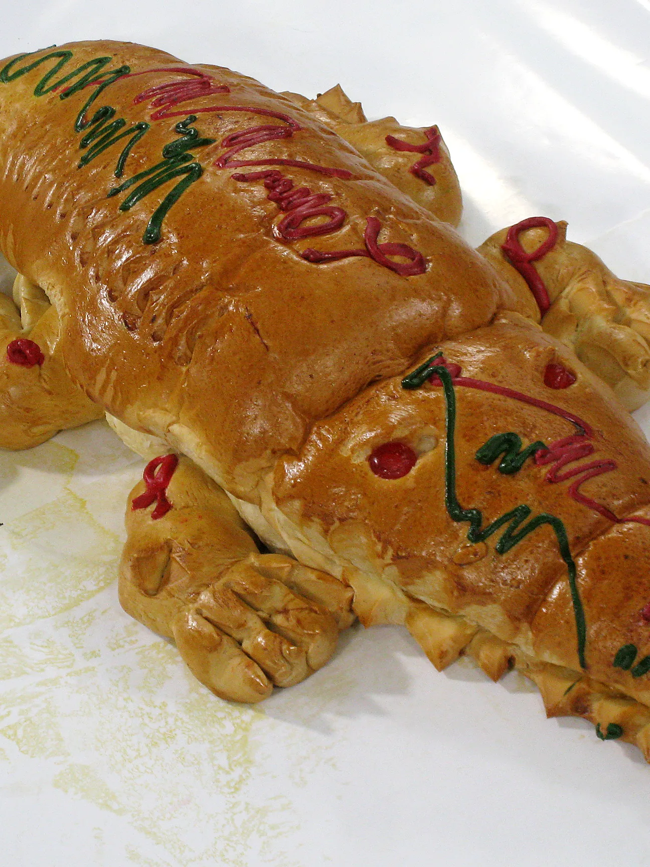 Roti buaya: Roti Buaya or "Crocodile Bread", is Betawi (native Jakartans) delicacy of crocodile shaped bread. It is often served in festive occassions such as weddings and celebrative moments. Jakarta, Indonesia